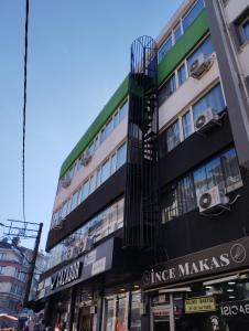 a building on a street in a city at Setpark Apart Otel in Bursa