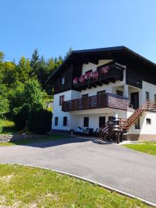 a large building with balconies on the side of it at Gogo in Delnice