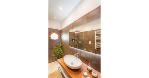 a bathroom with a sink and a mirror at Maison Desiderio in Sorrento +16 photos