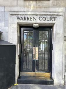 a door to a warren court on a building at Modernist Studio in Fitzrovia in London