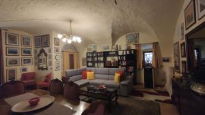 a living room with a couch and a table at Casa vacanza Todi Antica in Todi