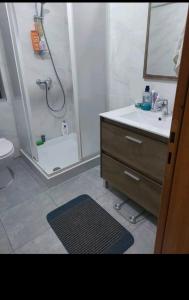 a bathroom with a shower and a sink at CASA GRIMA - private double room in Birkirkara