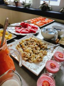 a table topped with food on a counter top at Pousada Mãe D'Água in Tiradentes