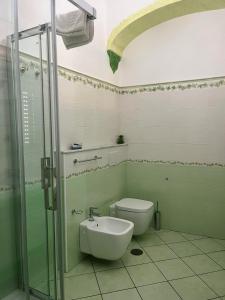 a bathroom with a toilet and a sink and a shower at Il Borgo in Agerola