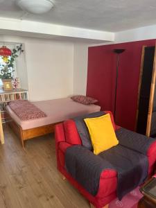 a living room with a couch and a bed at Homestay in Waldshut-Tiengen