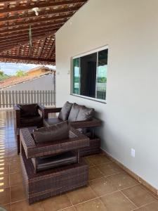 a living room with a couch and a window at Solar Calixto in Belém