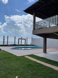 a swimming pool with a bridge in the background at Solar Calixto in Belém