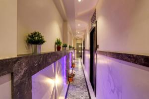a hallway with purple lighting in a building at DIAMOND HOTEL in Mumbai