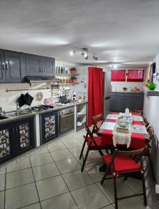 a kitchen with a table and chairs in a room at YourHome - La Dimora Di Nonna Angela in Positano