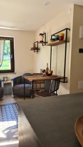a living room with a table and a couch at Cocooning in Arvier