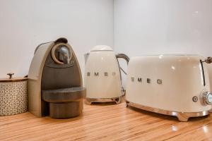 two toasters sitting on top of a wooden counter at Le Matilda - Appt Hypercentre 2 pers in Caen