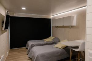 Postel nebo postele na pokoji v ubytování Hotel OmaBox - Nivala - Oma huoneisto saunalla