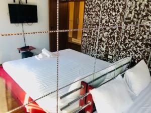 a bedroom with a swing bed and a tv at Joy City Stay Republicii 19 in Timişoara