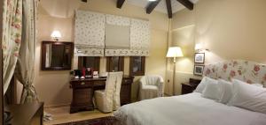 Posteľ alebo postele v izbe v ubytovaní Kazarma Hotel