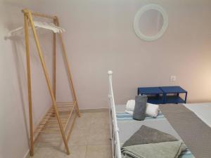 a bedroom with two bunk beds and a mirror at Blue central apt 10 min to the port/ wash machine in Lavrio
