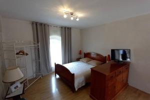 Katil atau katil-katil dalam bilik di Gîte Angevin 4 personnes