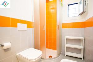 a bathroom with a toilet and a shower at LeS House - Apartment 2 by TuscanyWeGo in Pisa
