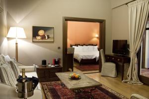 Posteľ alebo postele v izbe v ubytovaní Kazarma Hotel