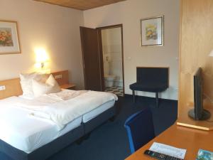 Postel nebo postele na pokoji v ubytování Hotel Klinger