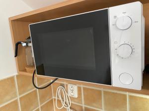 TV a/nebo společenská místnost v ubytování Apartmány Vltavanka