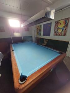 a large blue pool table in a room at Hostel SuzZzy in Novska