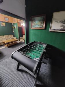 a room with a foosball table in the corner of a room at Hostel Suzzzy in Novska