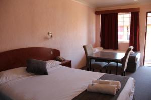 Postel nebo postele na pokoji v ubytování Childers Gateway Motor Inn