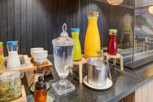 a group of different colored vases on a counter at Radisson Pinheiros in São Paulo