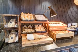 a bakery with lots of different types of bread at Radisson Pinheiros in São Paulo
