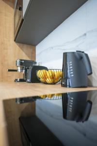 a kitchen counter with two toasters on a shelf at Alpha Level Apartment in Zadar +36 photos