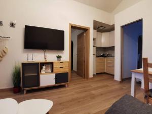 a living room with a flat screen tv on a wall at Montes Blancos in Costa Calma