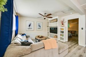 a living room with a couch and a tv at Chic La Mesa Retreat with Patio and Charcoal Grill! in La Mesa