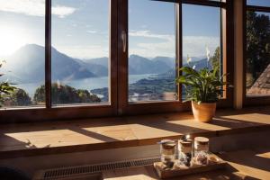 a room with windows with a view of a mountain at Gmundnerberghaus in Altmünster