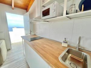 Kuchyň nebo kuchyňský kout v ubytování Eden Gomera Suites