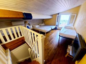 Cama o camas de una habitación en Appartement T6. Emplacement et vue mer d'exception