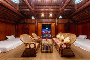 Giường trong phòng chung tại Trang An Ao Dai Homestay