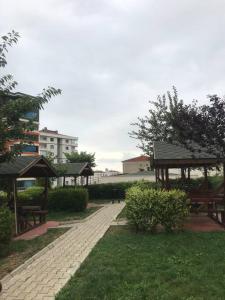 a park with benches and a pavilion in the grass at Ultra lüx Klimalı Daire in Trabzon