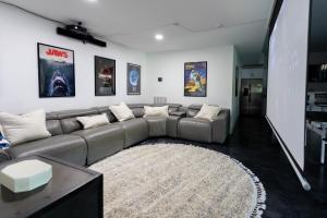 a living room with a couch and a rug at The Shoal Creek Chateau Lake House in Florence