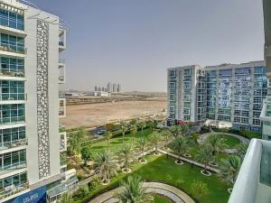 an aerial view of a city with palm trees and buildings at Key View - Glitz 3, Tower 2 in Dubai