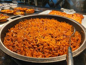 a large pan filled with food on a table at Lloret Vibe Affiliated by FERGUS in Lloret de Mar