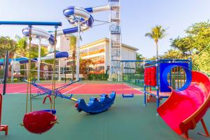 a playground with a slide and a slide at Hotel Vilage Inn Ribeirão Preto & Convenções in Ribeirão Preto