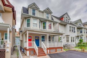 a row of houses in a row at Vibrant East Orange Townhome Near Red Bull Arena! in East Orange