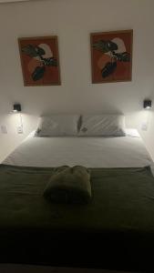 Un pat sau paturi într-o cameră la Zuppolini Garden Hotel Oficial