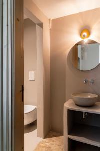 a bathroom with a sink and a mirror on the wall at Masseria Gorgognolo in Ostuni