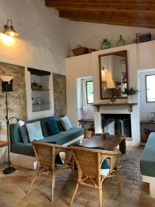 a living room with a couch and a table at Casas de Almajar in Prado del Rey