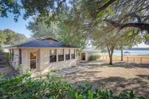 a stone house with a view of the water at Temple Retreat with Cliffside Belton Lake Views! in Temple
