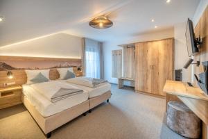 Postel nebo postele na pokoji v ubytování Hotel Schaider