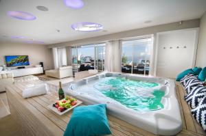 a large bath tub in a living room at Chateau Glili in Safed