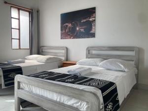 Postel nebo postele na pokoji v ubytování Hotel Casa de las Dos Palmas -Hotel Boutique