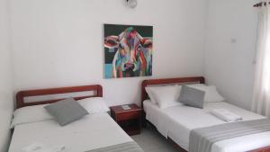 Postel nebo postele na pokoji v ubytování Hotel Casa de las Dos Palmas -Hotel Boutique